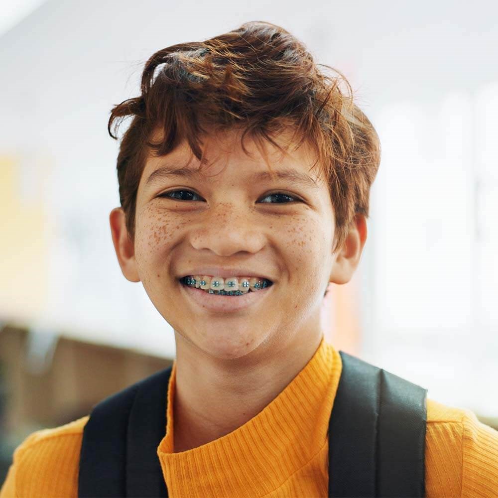 Boy with Braces Smiling