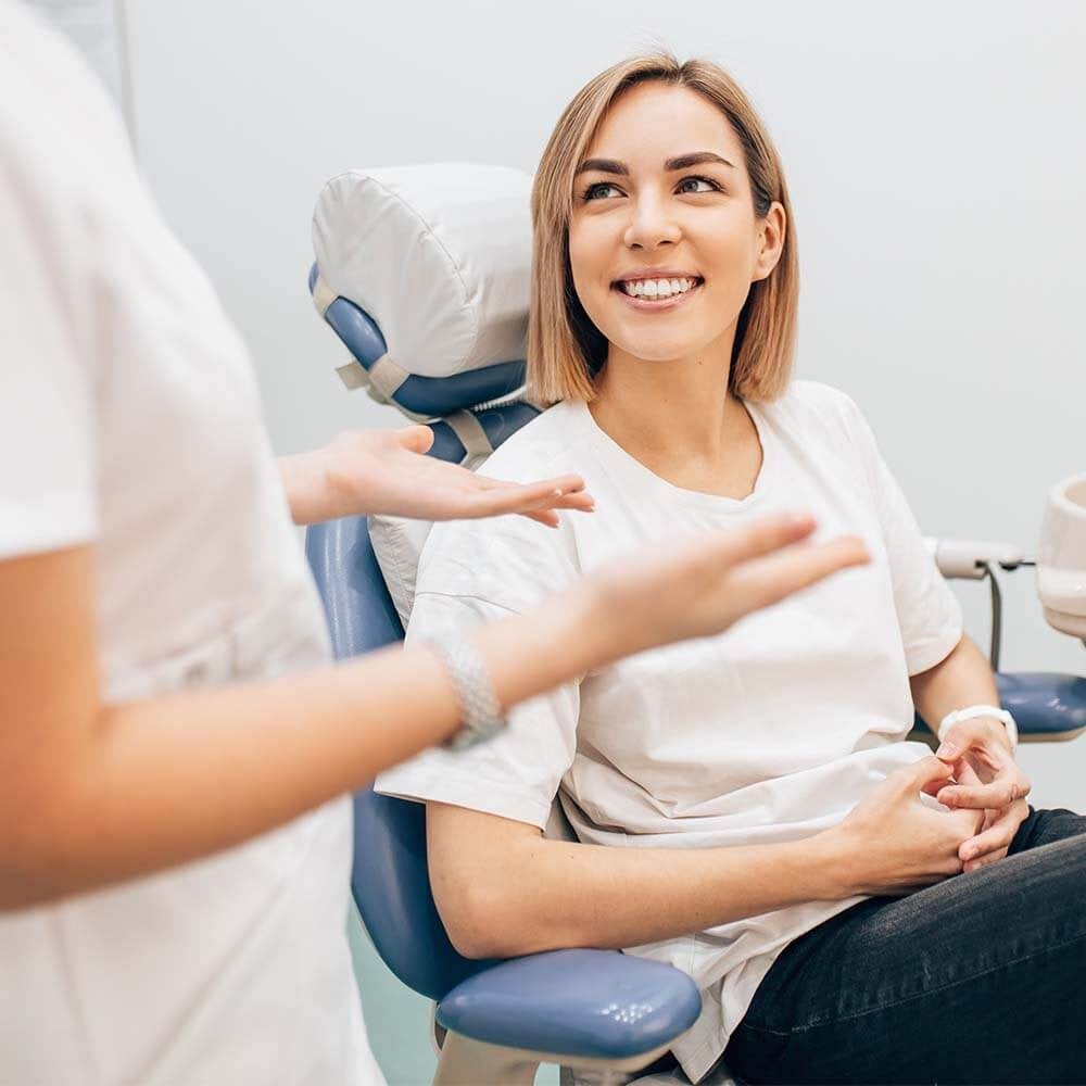 Woman Smiling During Orthodontic Consultation