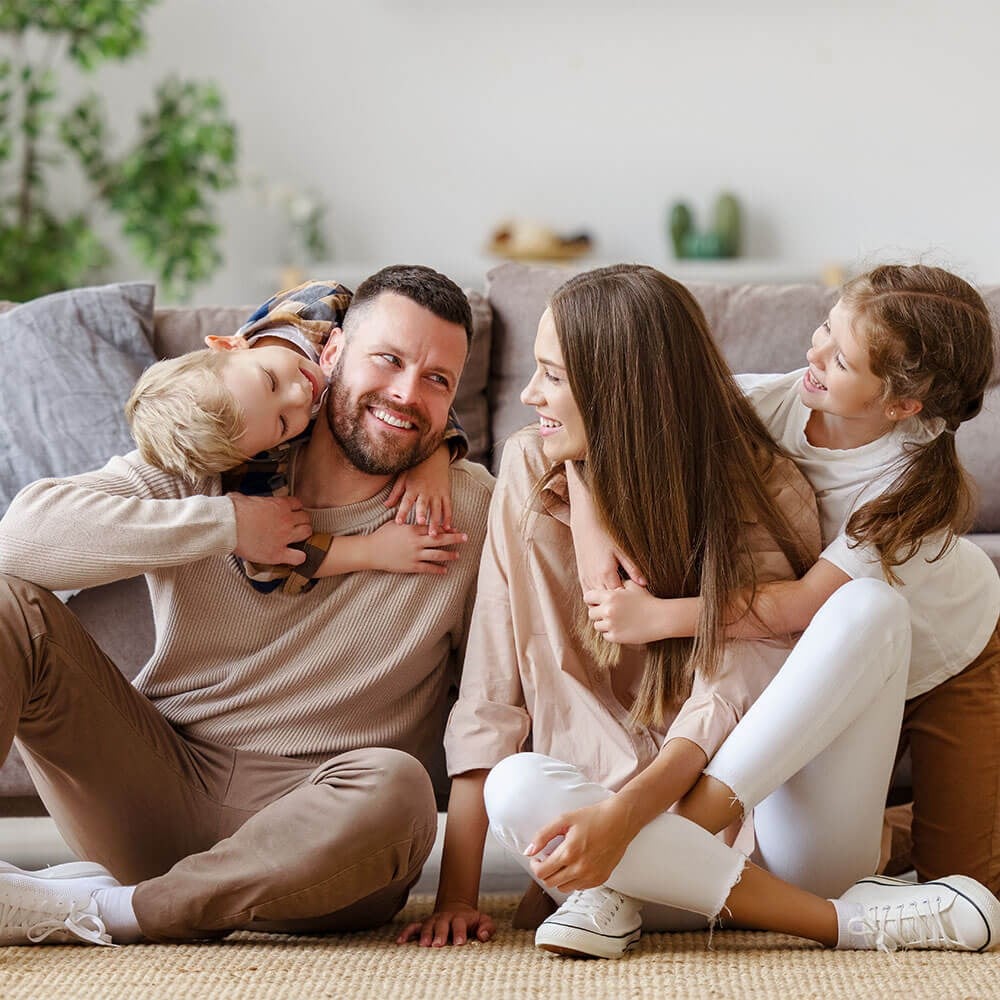 Family on the Couch Smiling